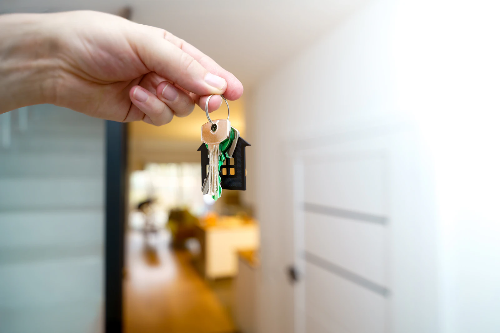Handing over house keys at a front door