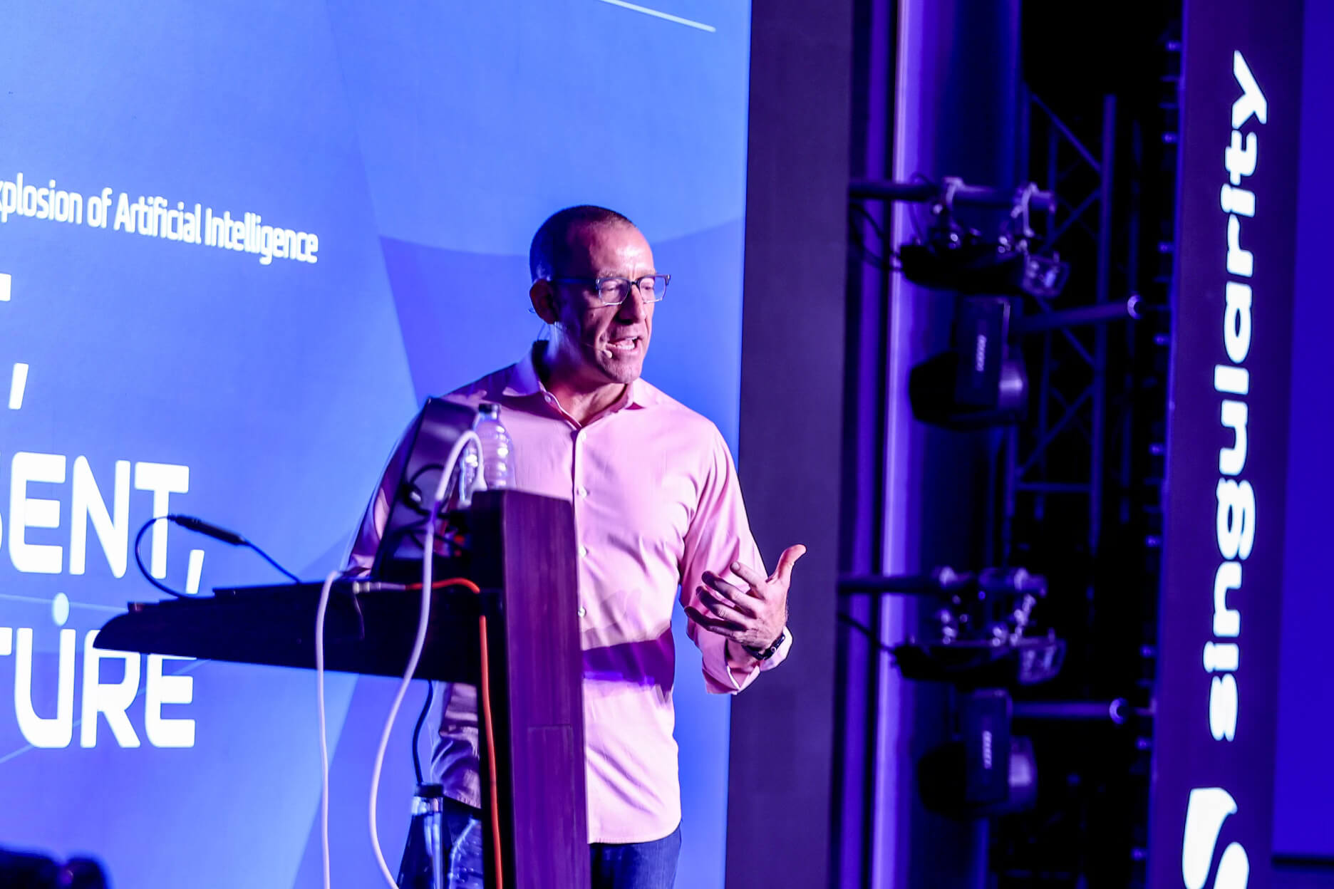 Michael Housman delivering an AI keynote to a large audience